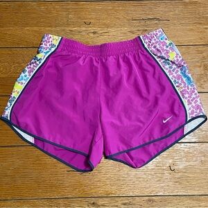 Nike Women's Magenta Running Shorts with colorful Side Panels.